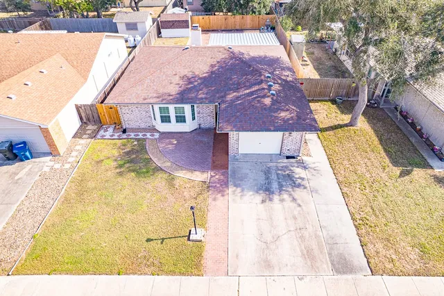 a house with swimming pool in front of it