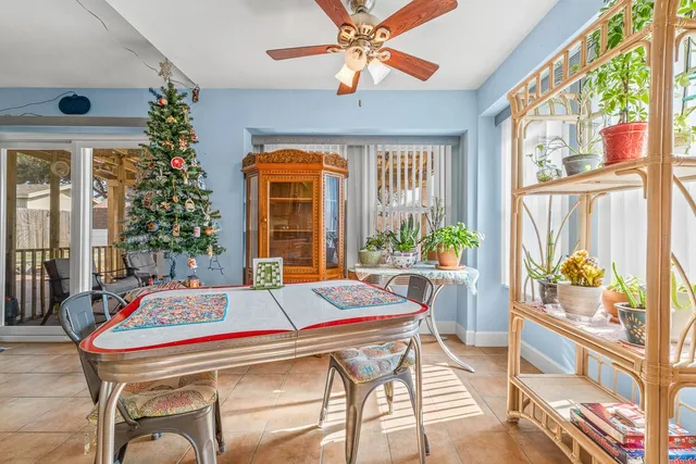 a living room with a large window and table