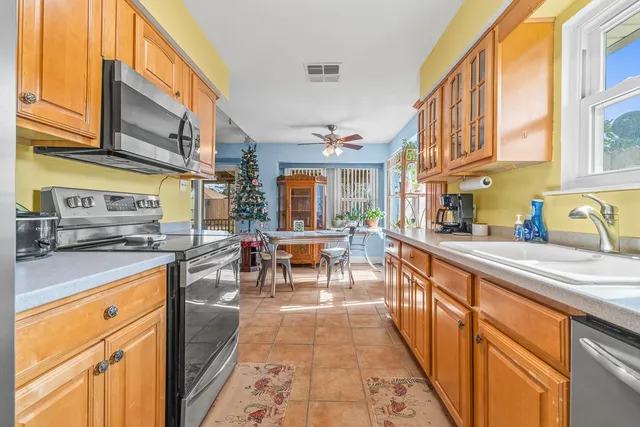 a kitchen with stainless steel appliances granite countertop lots of counter top space