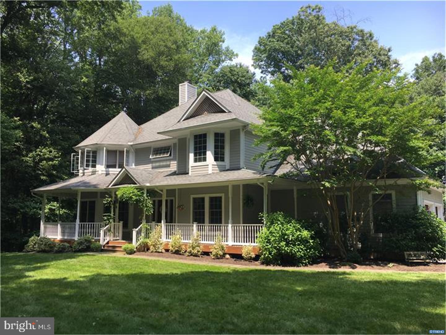 835 Pennock Bridge Road Landenberg, PA 19350 - Photo 1 of 25 a front view of a house with a yard table and chairs