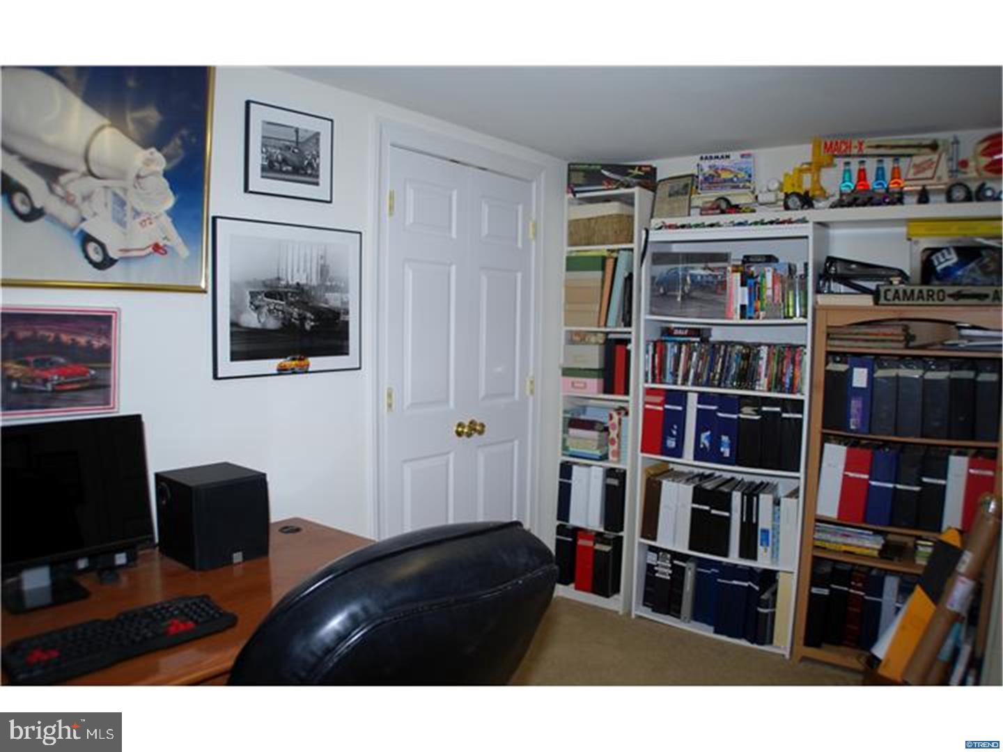 835 Pennock Bridge Road Landenberg, PA 19350 - Photo 18 of 25 a living room with lots of books and a book shelf