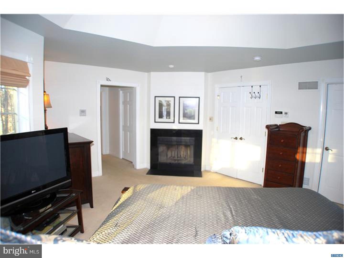 835 Pennock Bridge Road Landenberg, PA 19350 - Photo 21 of 25 a living room with a fireplace and a flat screen tv
