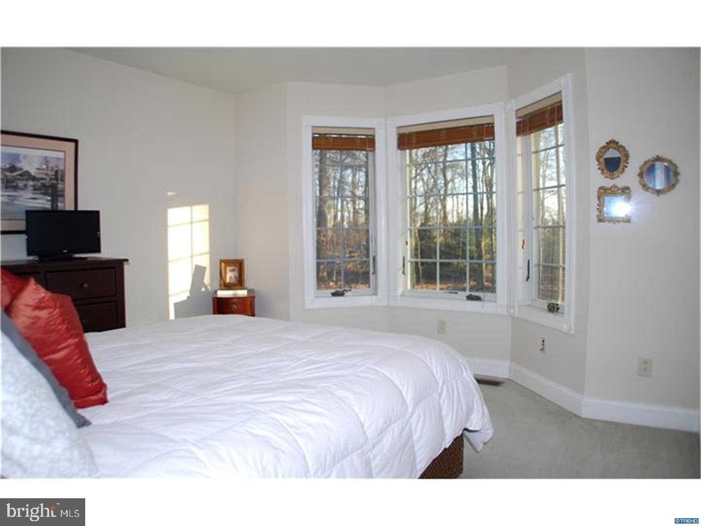 835 Pennock Bridge Road Landenberg, PA 19350 - Photo 24 of 25 a bedroom with a large bed and a flat tv screen on a dresser