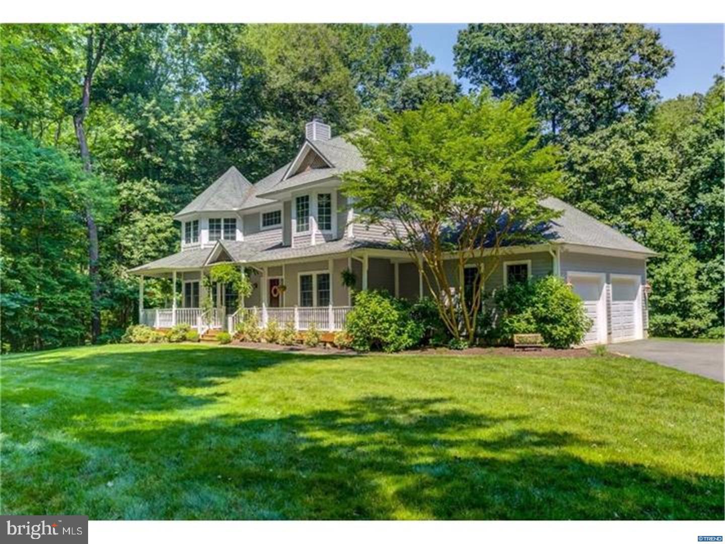 835 Pennock Bridge Road Landenberg, PA 19350 - Photo 5 of 25 a front view of a house with a yard table and chairs