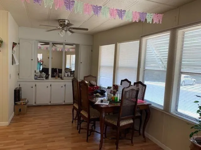 a view of a dining room with furniture and window