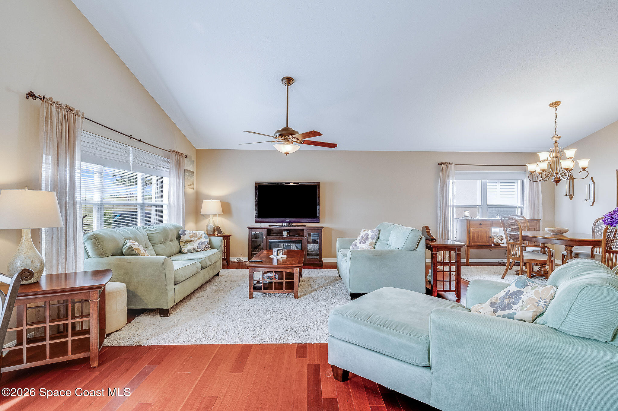 4910 Worthington Circle Rockledge, FL 32955 - Photo 23 of 69 a living room with furniture a flat screen tv and a window