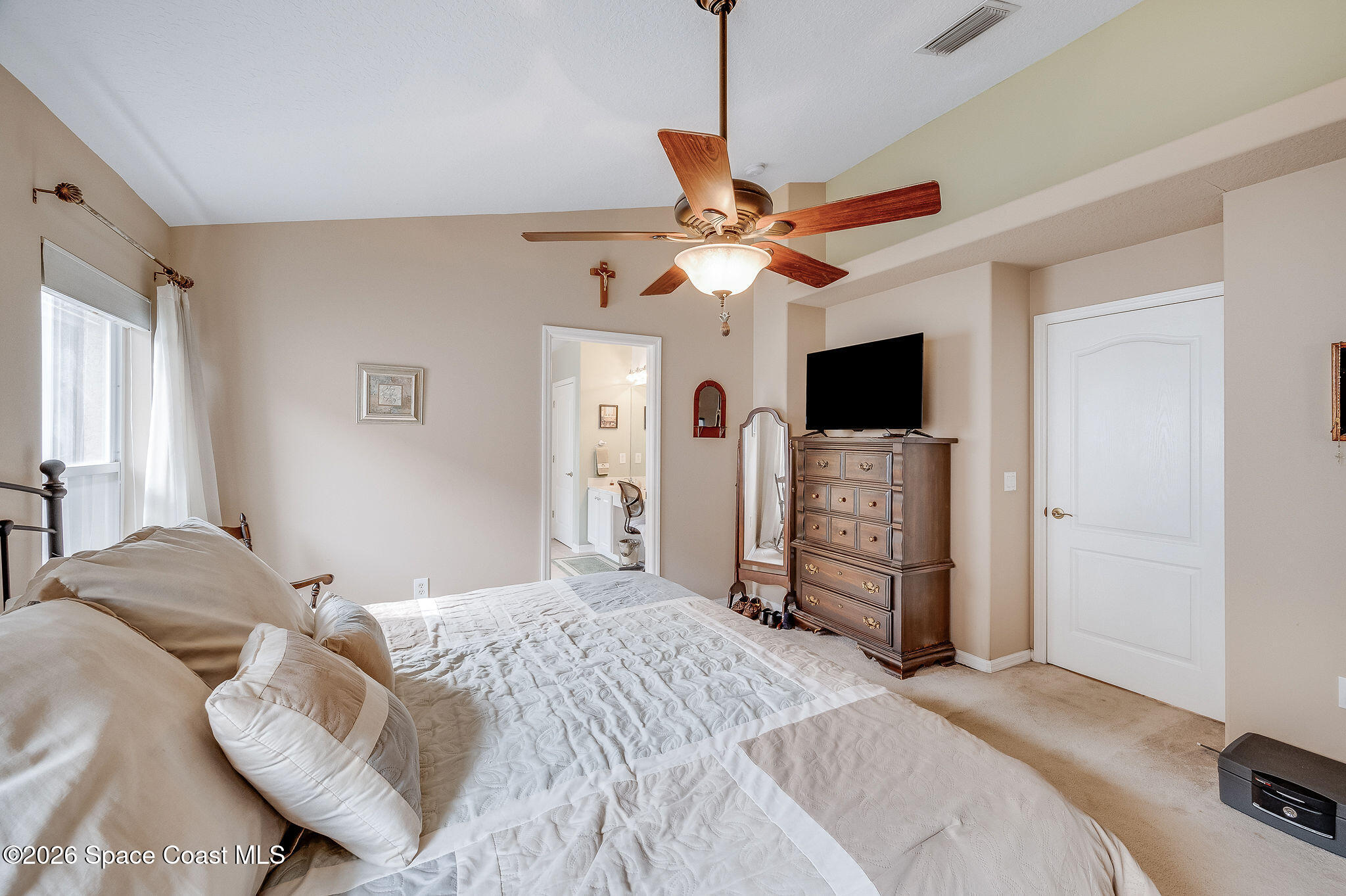 4910 Worthington Circle Rockledge, FL 32955 - Photo 31 of 69 a bedroom with a bed and a flat screen tv