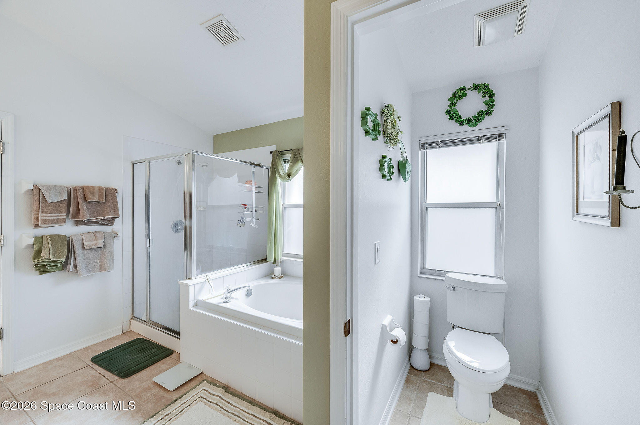 4910 Worthington Circle Rockledge, FL 32955 - Photo 34 of 69 a bathroom with a bathtub shower and toilet