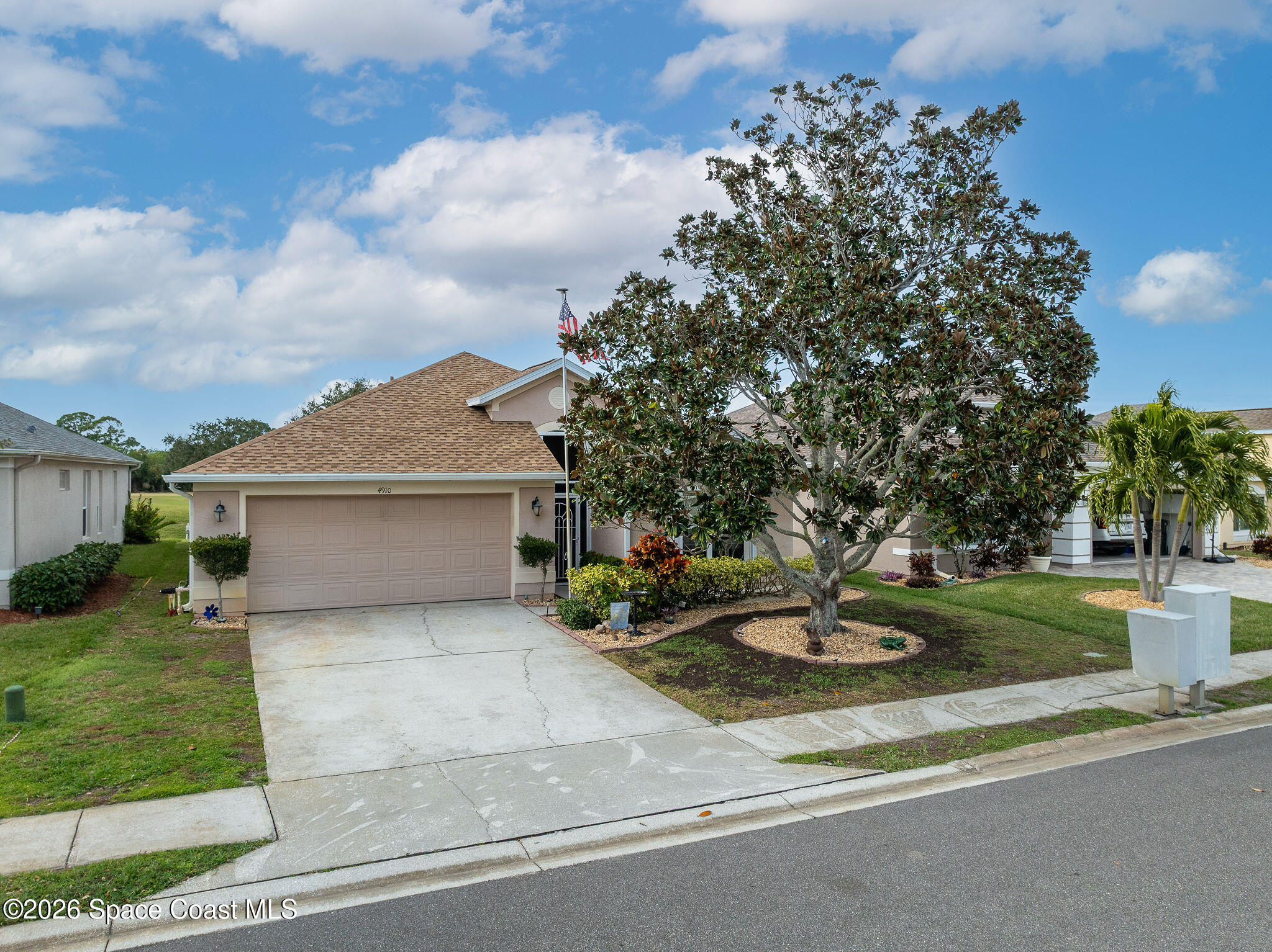 4910 Worthington Circle Rockledge, FL 32955 - Photo 54 of 69 front view of a house with a yard and garage