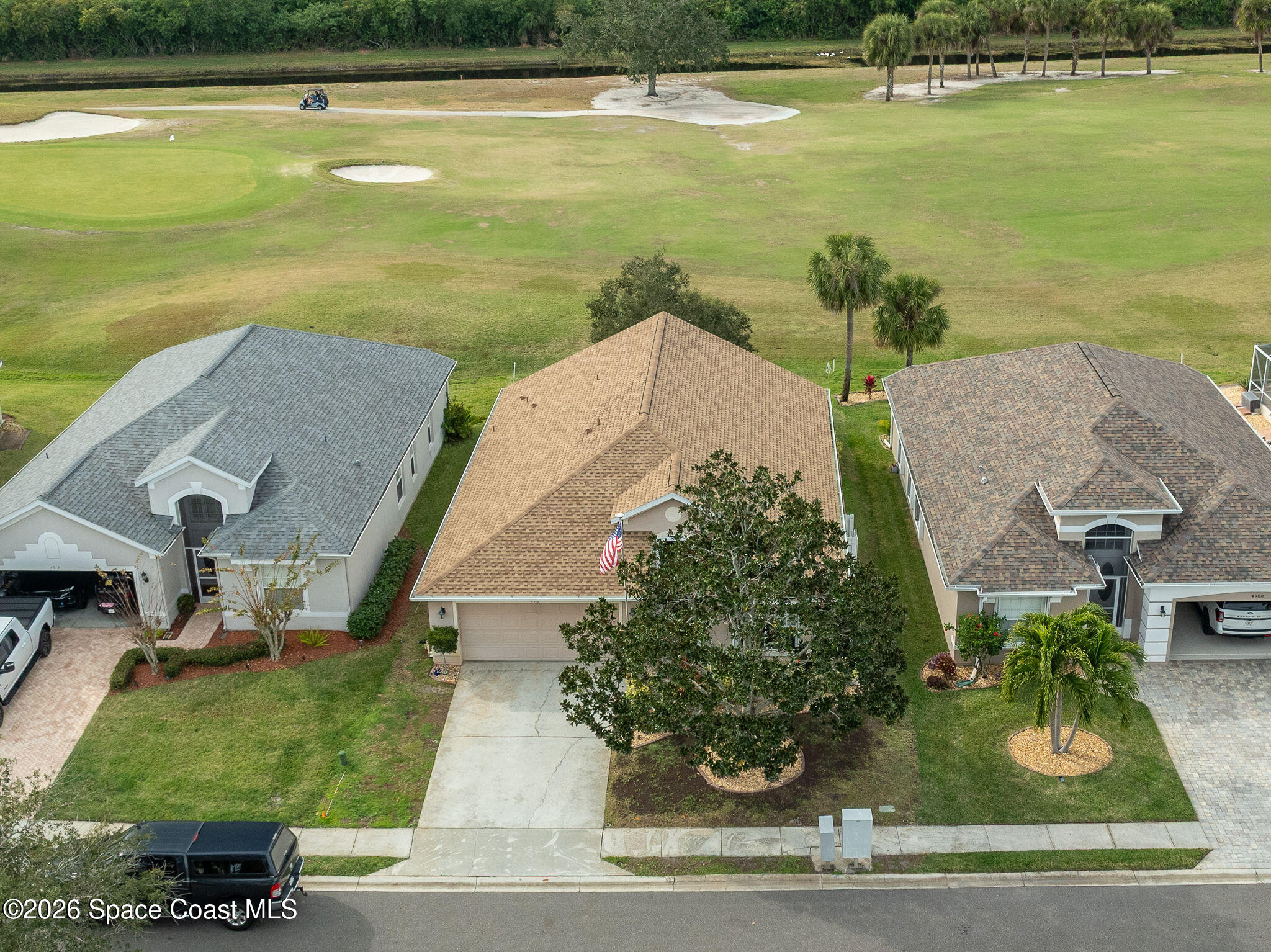 4910 Worthington Circle Rockledge, FL 32955 - Photo 57 of 69 an aerial view of a house with a garden and lake view