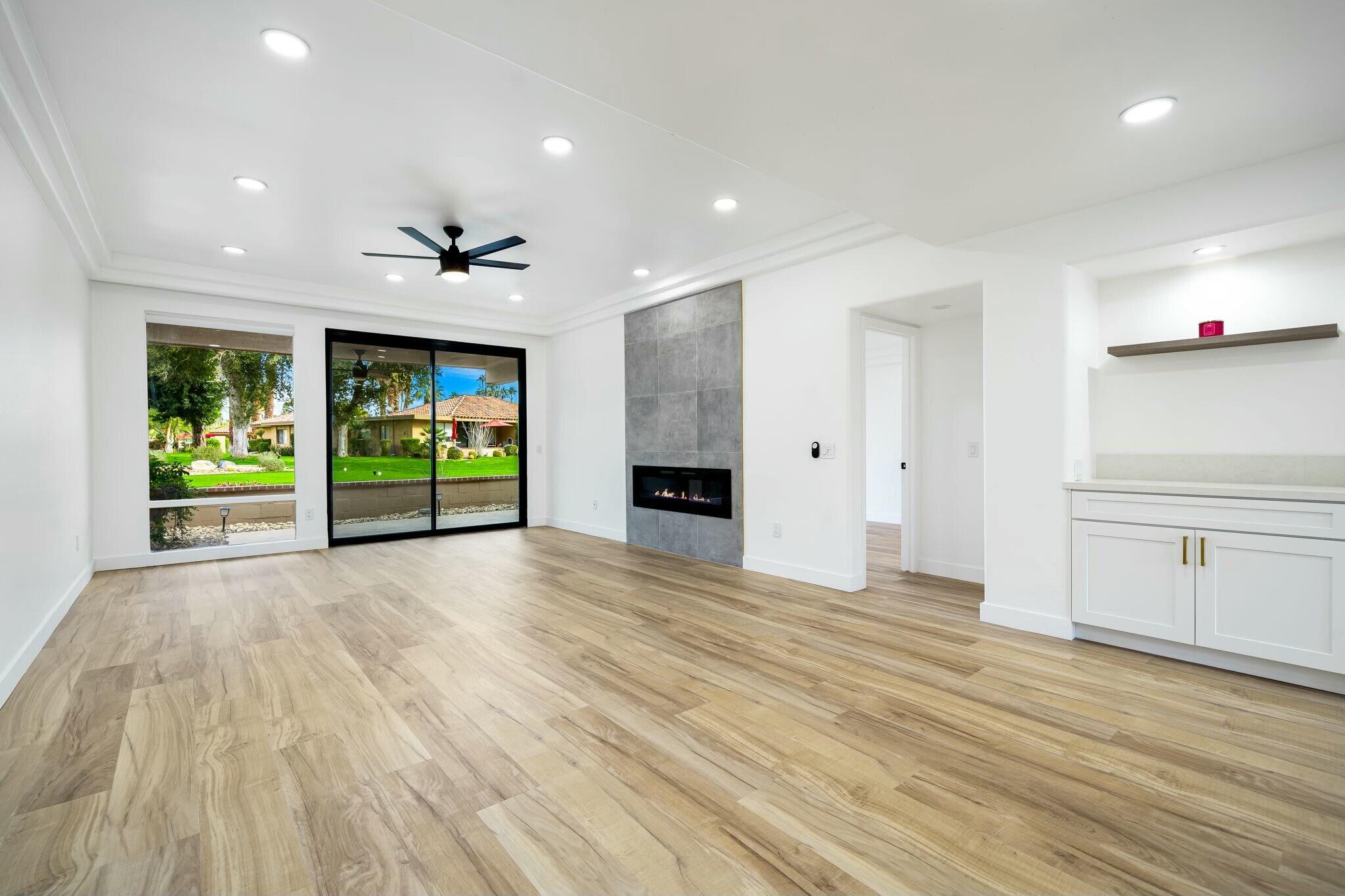 75 Sunrise Drive Rancho Mirage, CA 92270 - Photo 12 of 40 a view of an empty room with a window and wooden floor