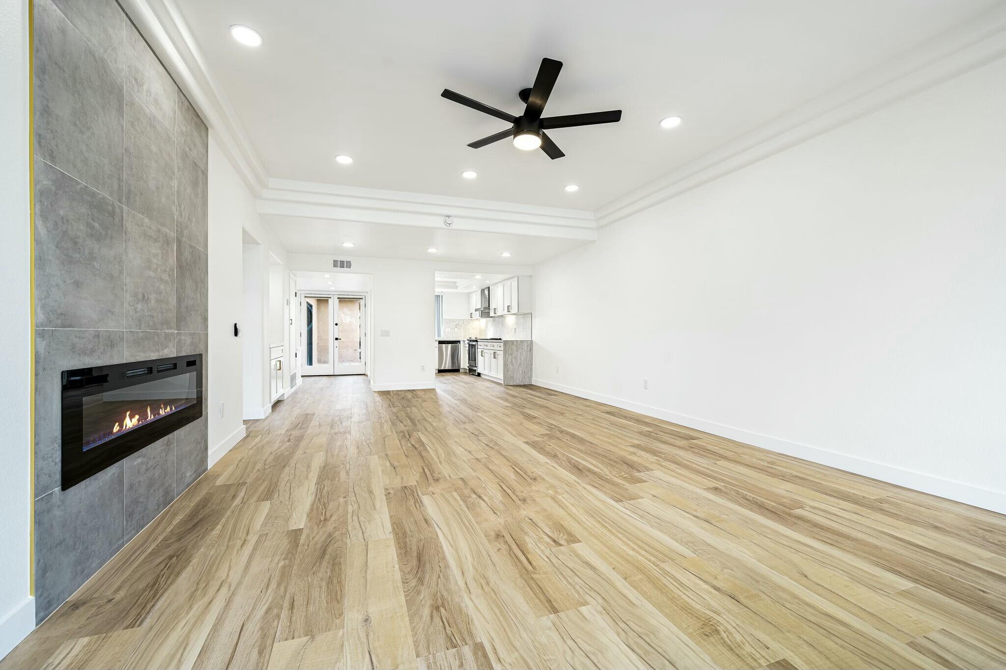 75 Sunrise Drive Rancho Mirage, CA 92270 - Photo 14 of 40 a view of a livingroom with a ceiling fan and wooden floor