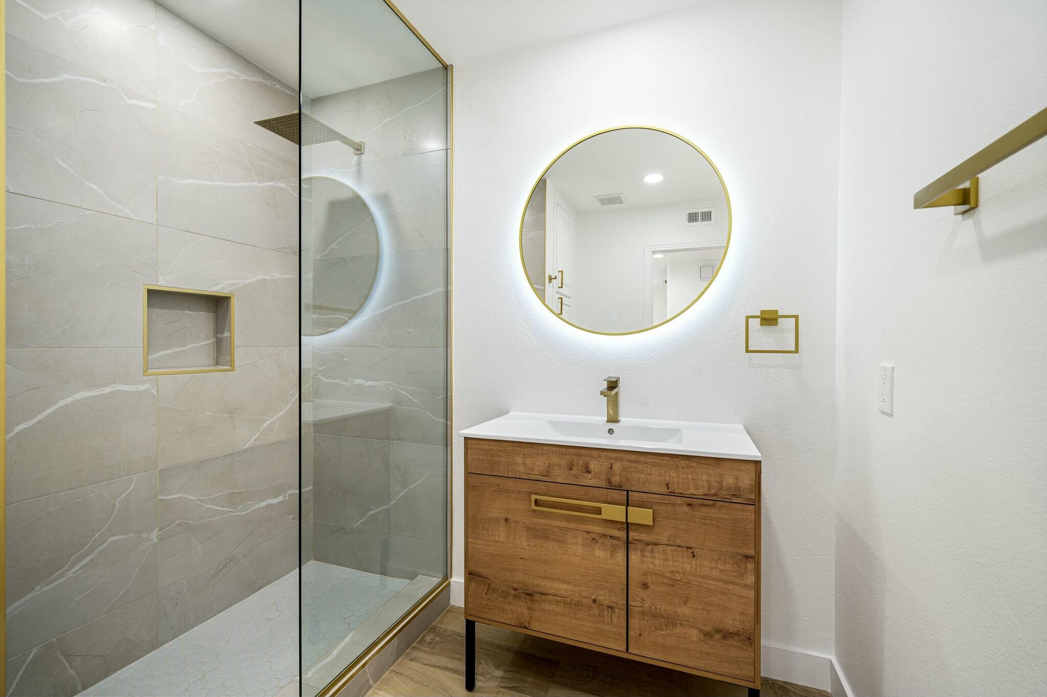 75 Sunrise Drive Rancho Mirage, CA 92270 - Photo 17 of 40 a bathroom with a sink a vanity and a mirror