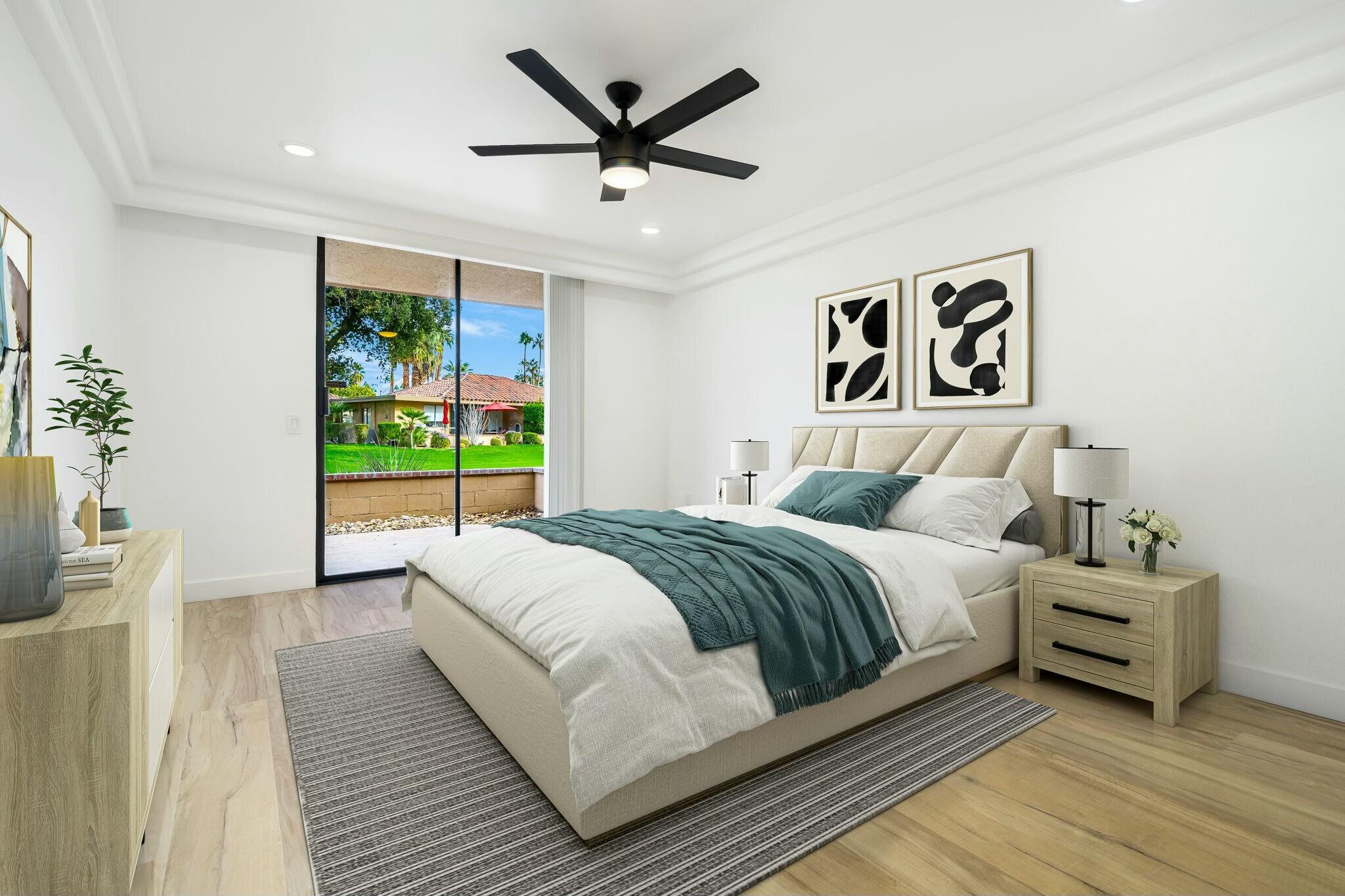 75 Sunrise Drive Rancho Mirage, CA 92270 - Photo 19 of 40 a bedroom with a large bed and a large window