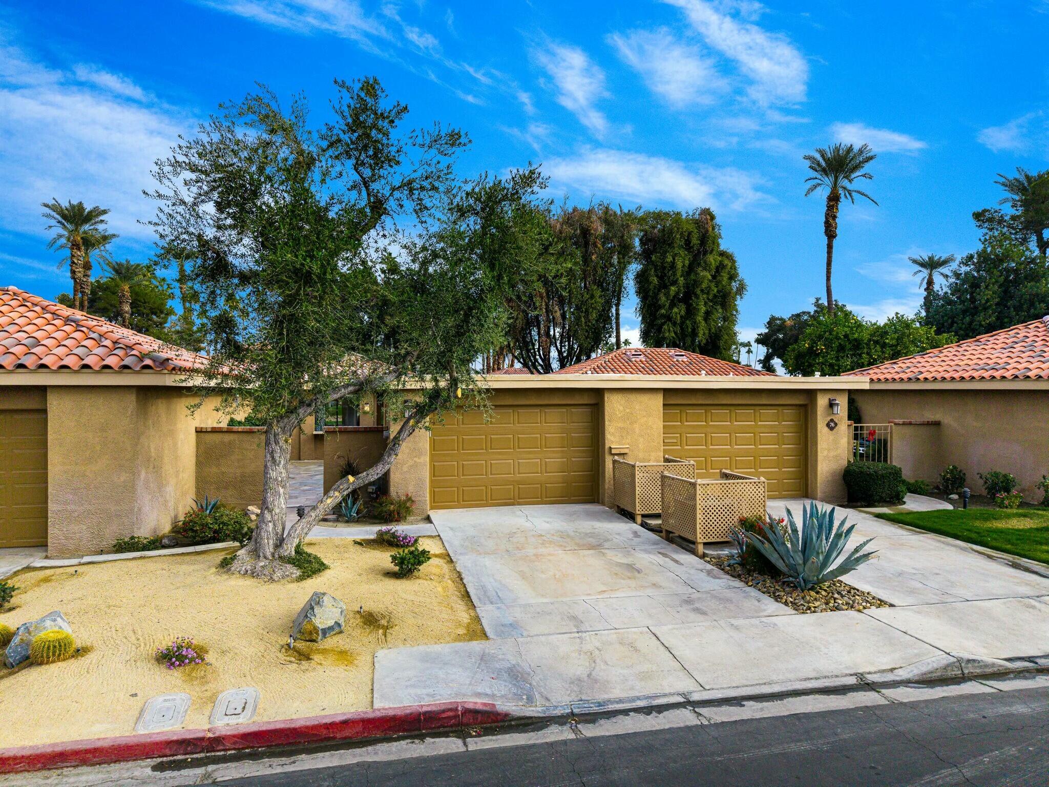 75 Sunrise Drive Rancho Mirage, CA 92270 - Photo 29 of 40 a view of a swimming pool with a patio