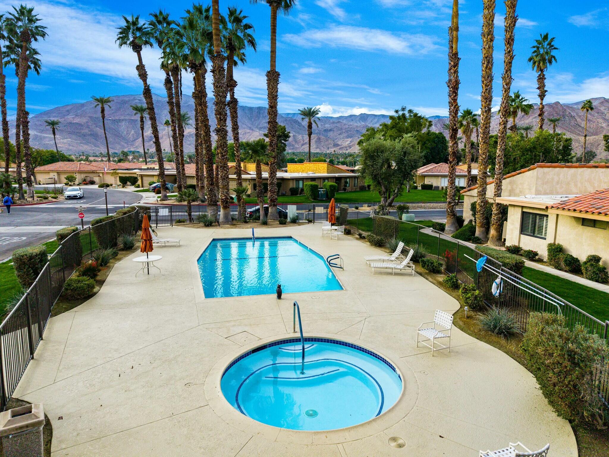 75 Sunrise Drive Rancho Mirage, CA 92270 - Photo 31 of 40 a swimming pool with outdoor seating and yard