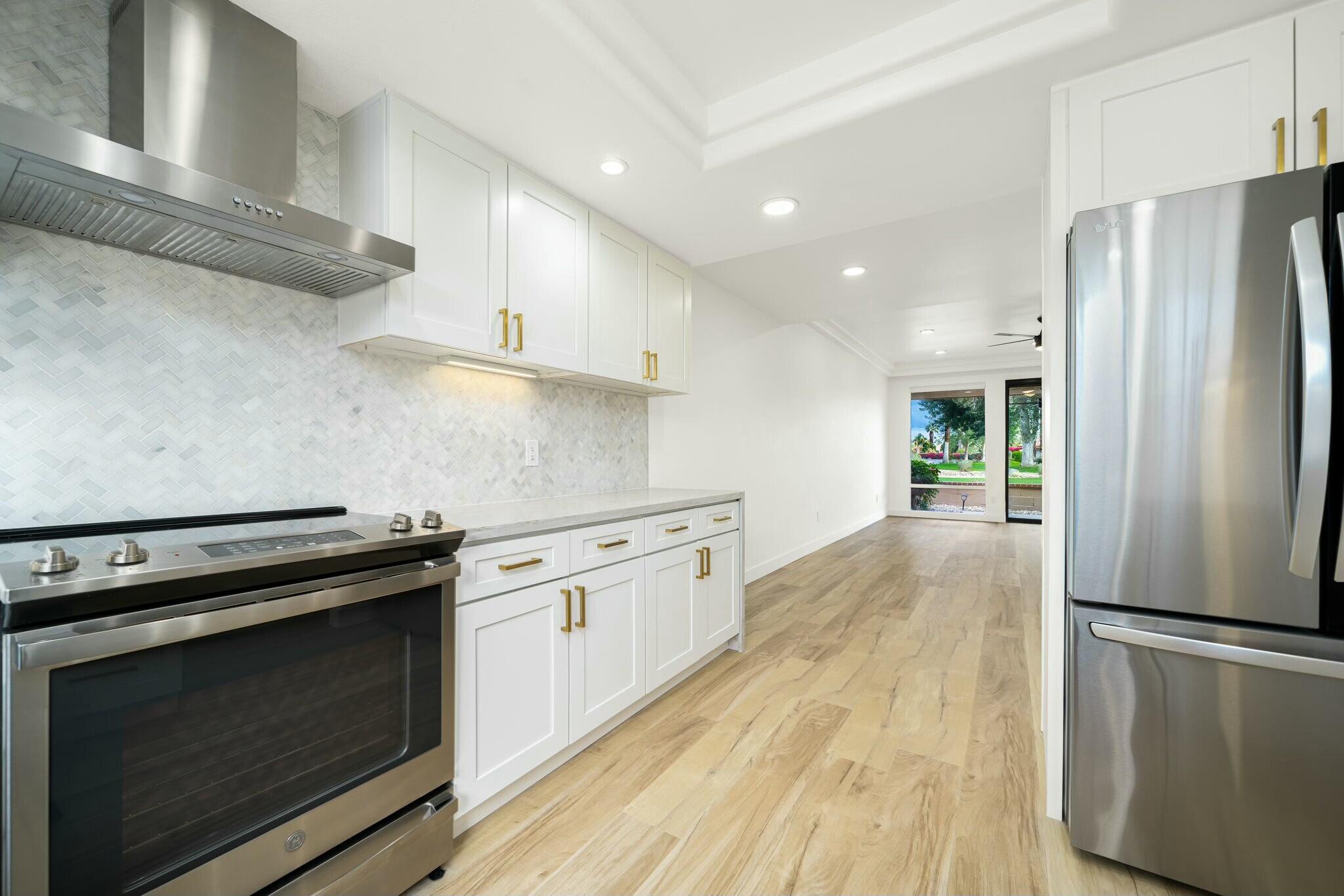 75 Sunrise Drive Rancho Mirage, CA 92270 - Photo 7 of 40 a kitchen with a stove refrigerator and microwave