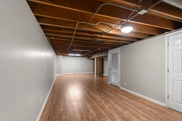 a view of room with wooden floor