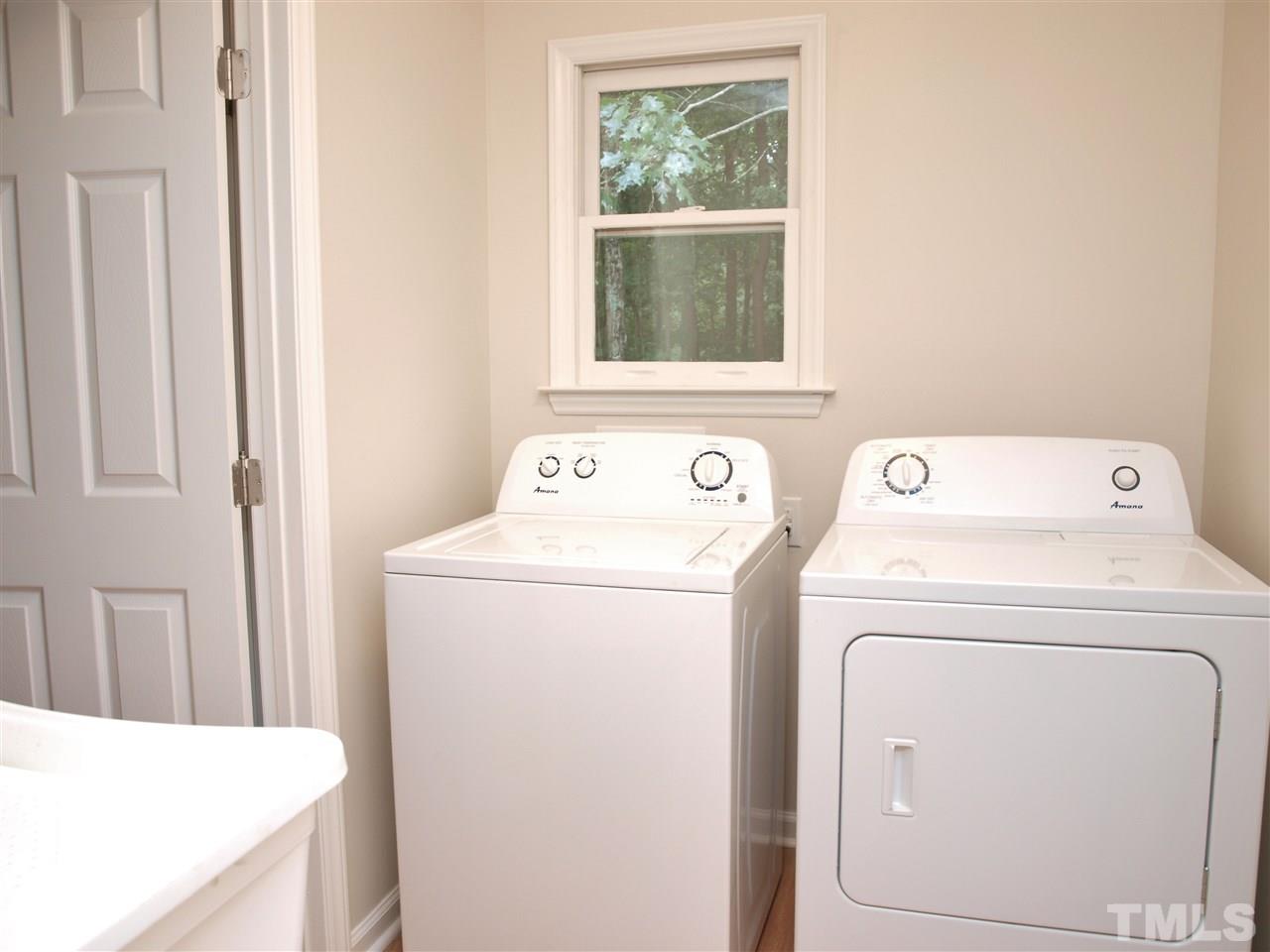 7505 Ray Road Raleigh, NC 27613 - Photo 14 of 18 a utility room with dryer and washer
