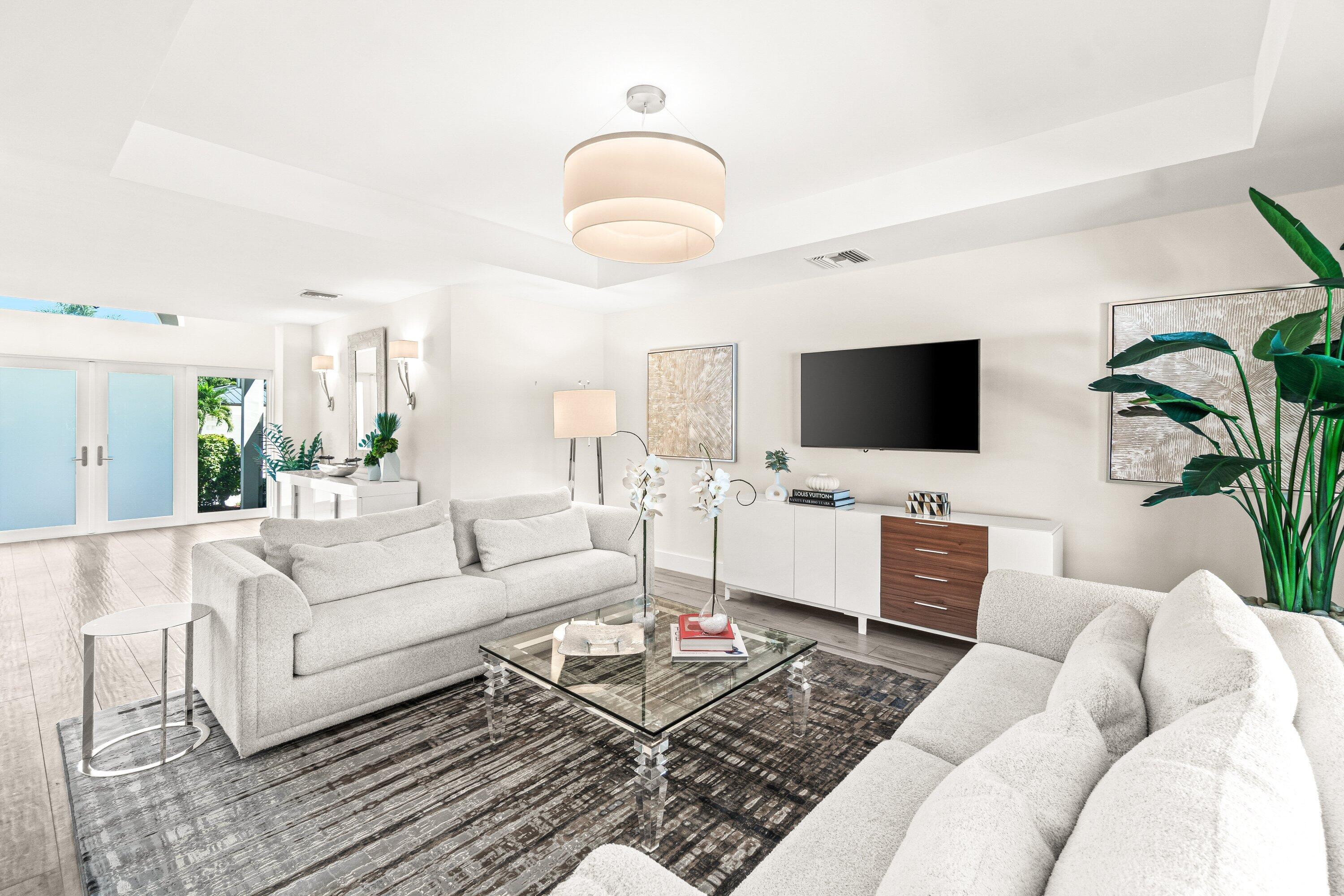 2367 Queen Palm Road Boca Raton, FL 33432 - Photo 2 of 44 a living room with furniture and a flat screen tv