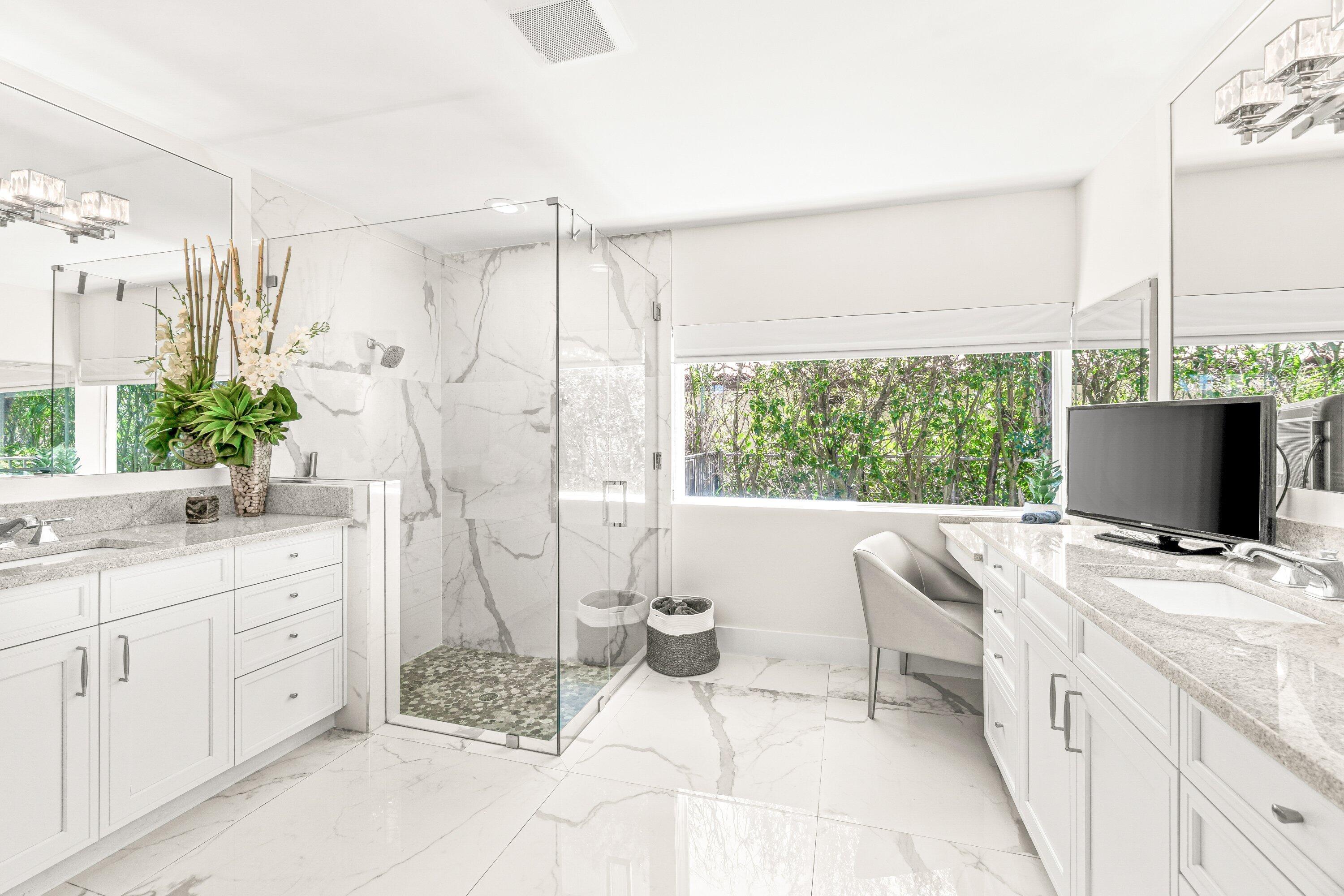 2367 Queen Palm Road Boca Raton, FL 33432 - Photo 27 of 44 a view of a kitchen with kitchen island a sink a counter and a view of living room