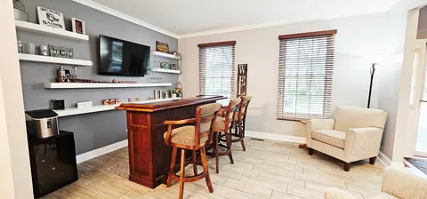 a kitchen with refrigerator and stove