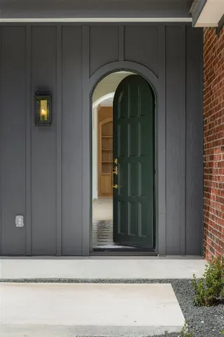 a kitchen with granite countertop a sink and a window
