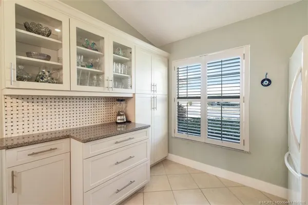 a kitchen with a cabinets and a window