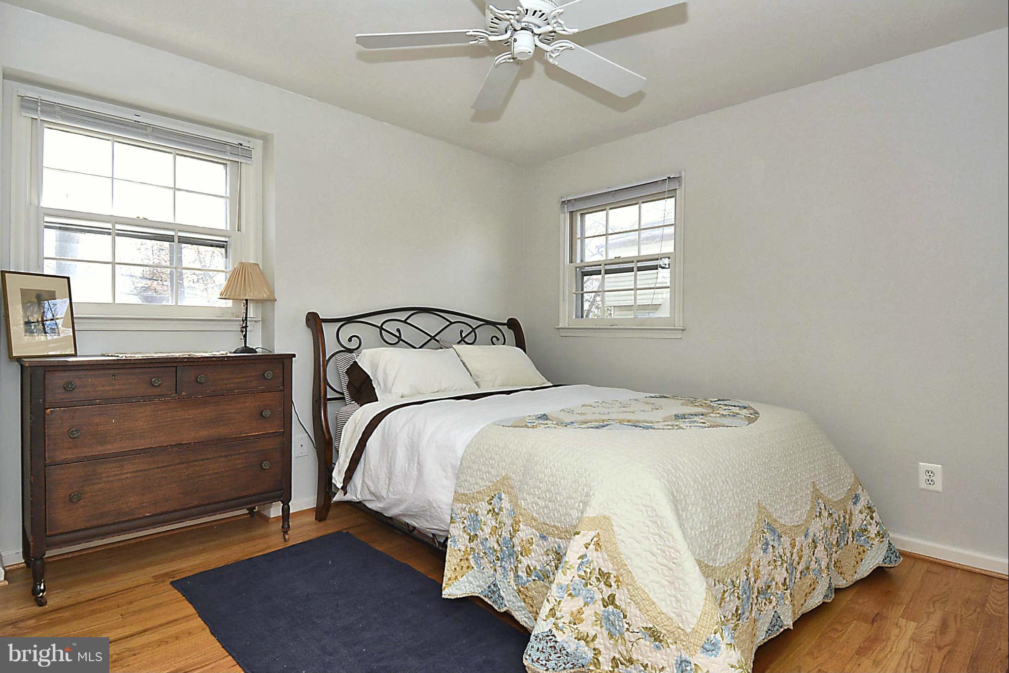 1712 Billman Lane Silver Spring, MD 20902 - Photo 22 of 30 a bedroom with a bed and window