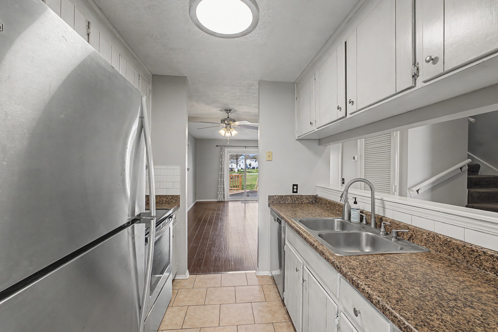4316 Baton Rouge Drive Hermitage, TN 37076 - Photo 9 of 20 a kitchen with granite countertop a sink a counter top space and cabinets