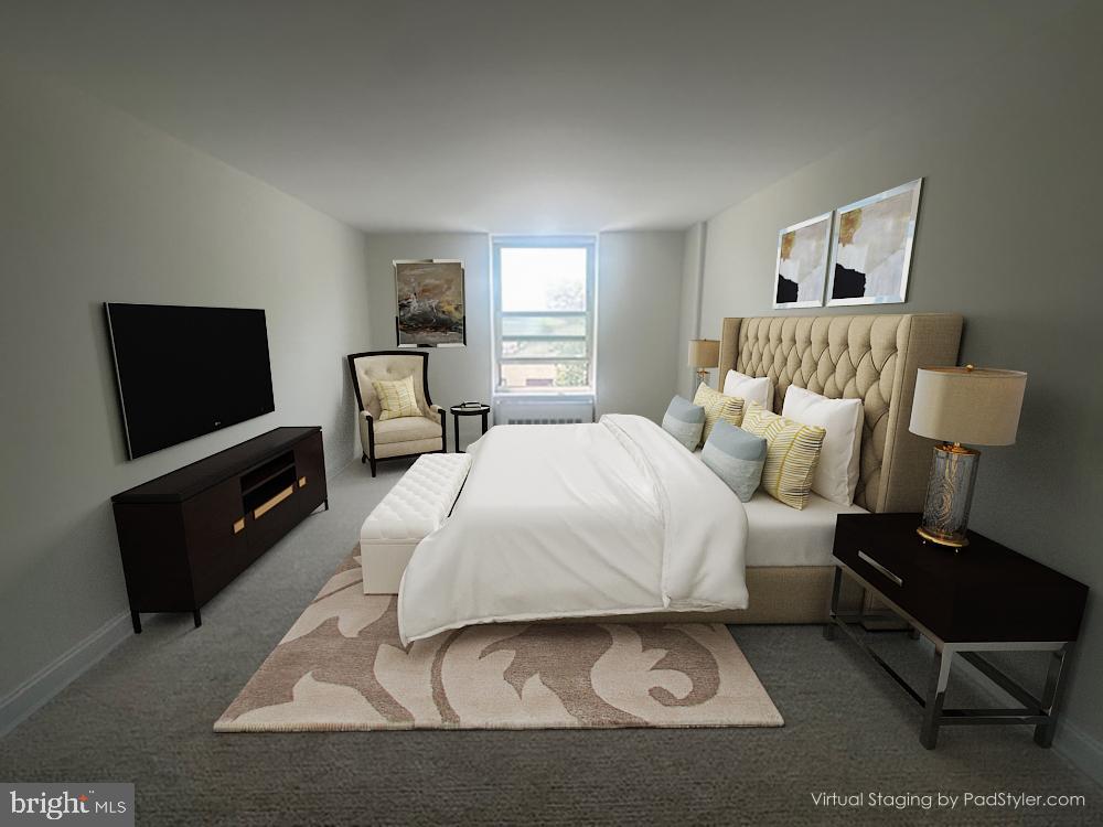 41 Conshohocken State Road, Unit 510 Bala Cynwyd, PA 19004 - Photo 14 of 32 a bedroom with a bed a couch and dresser