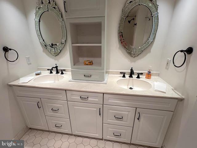 41 Conshohocken State Road, Unit 510 Bala Cynwyd, PA 19004 - Photo 17 of 32 a bathroom with a double vanity sink and a mirror