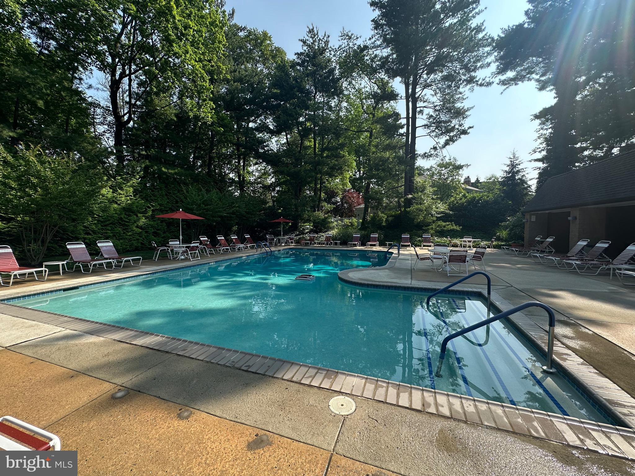 41 Conshohocken State Road, Unit 510 Bala Cynwyd, PA 19004 - Photo 27 of 32 a view of swimming pool with lawn chairs and plants