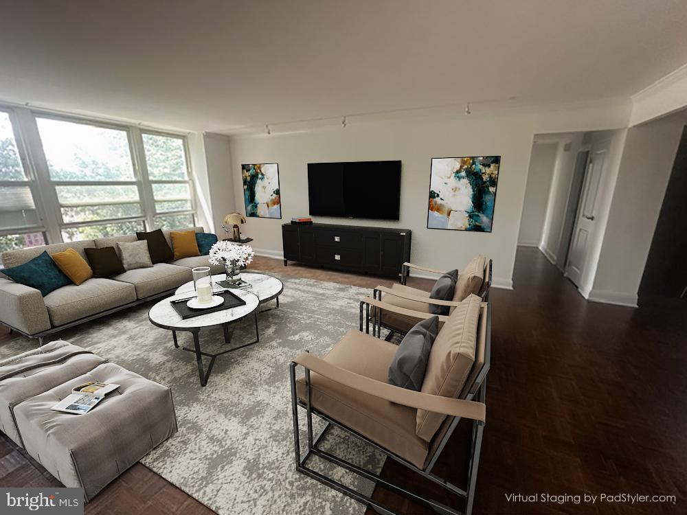 41 Conshohocken State Road, Unit 510 Bala Cynwyd, PA 19004 - Photo 6 of 32 a living room with furniture and a flat screen tv
