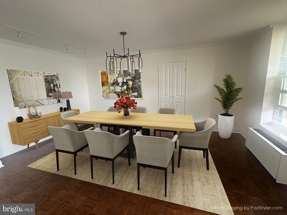 41 Conshohocken State Road, Unit 510 Bala Cynwyd, PA 19004 - Photo 8 of 32 a dining room with furniture a chandelier and wooden floor