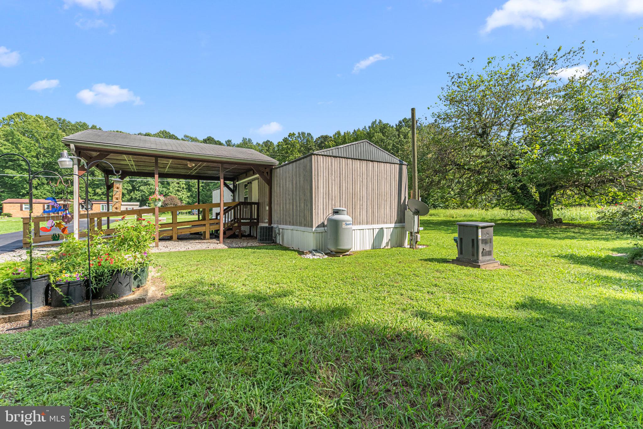 471 Burrells Marina Road Urbanna, VA 23175 - Photo 32 of 36 Beautifual lawn and flowers