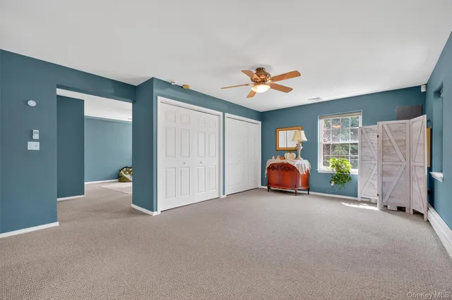 a view of livingroom with furniture and ceiling fan