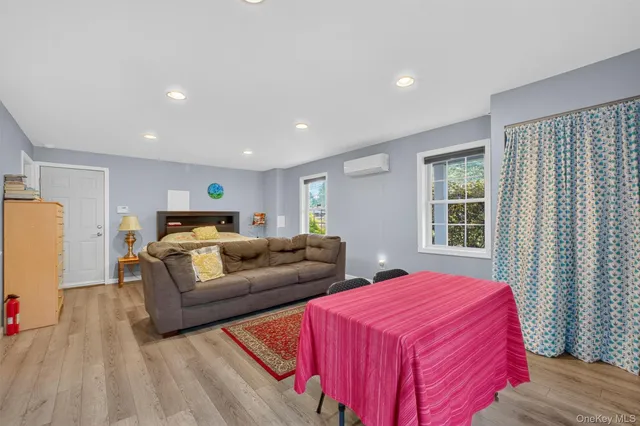 a bedroom with a bed and a couch