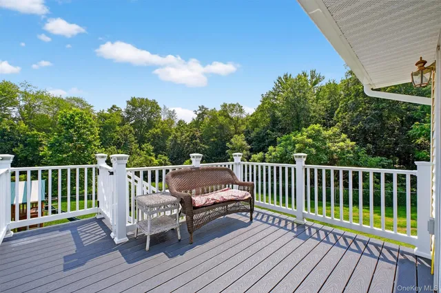 a view of a wooden deck with a bench
