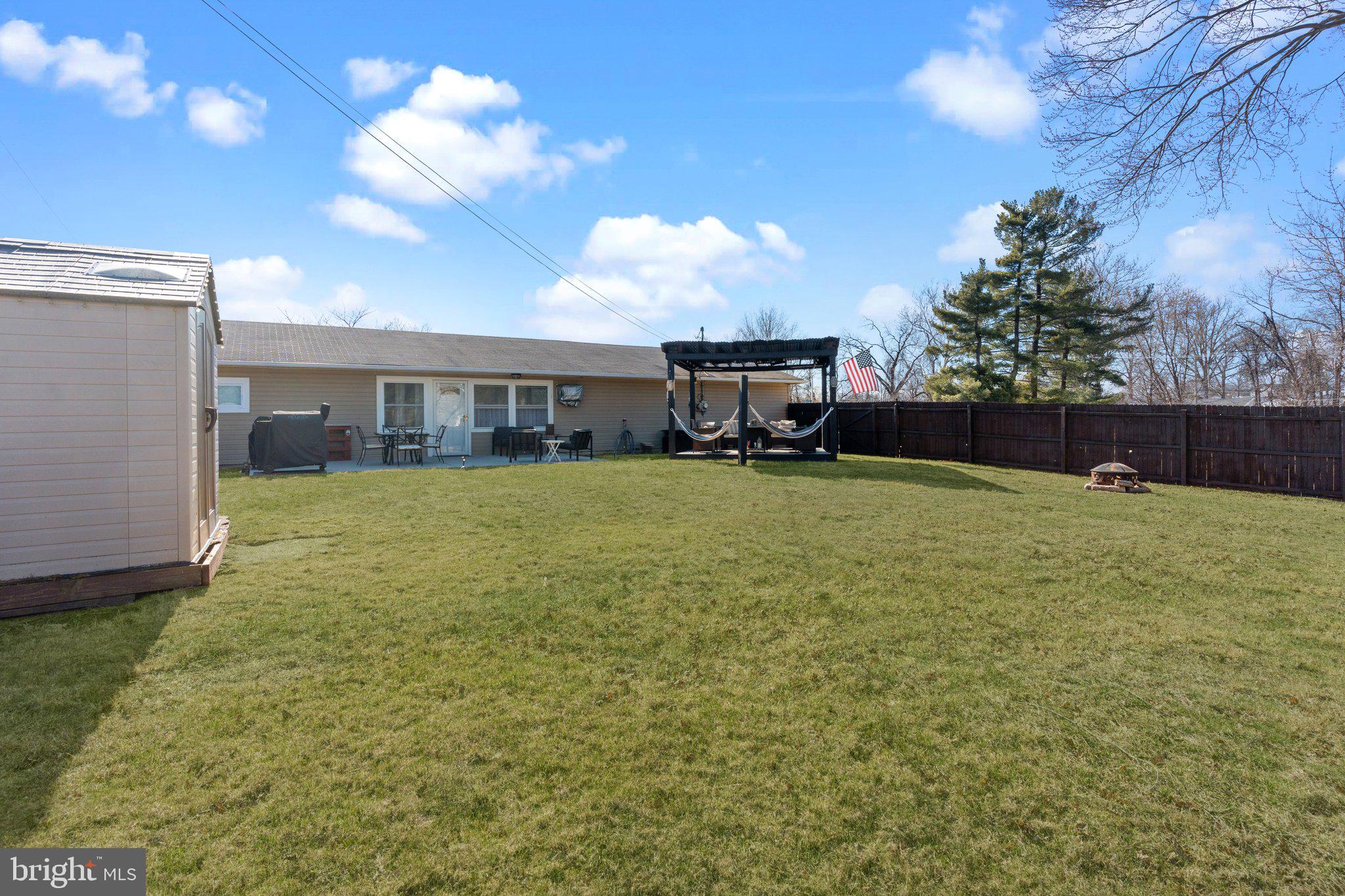56 Old Pond Road Levittown, PA 19057 - Photo 19 of 20 a view of a house with a yard and sitting area