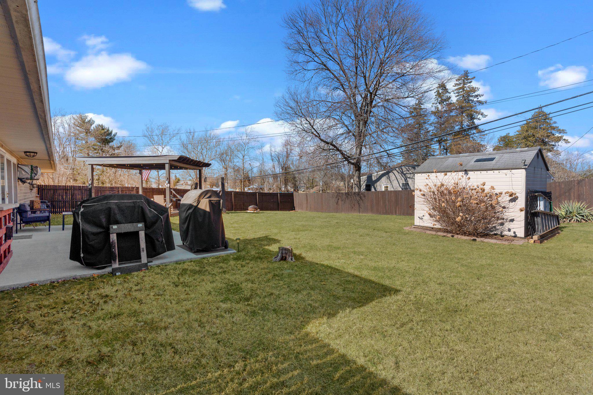 56 Old Pond Road Levittown, PA 19057 - Photo 20 of 20 a view of a yard with table and chairs