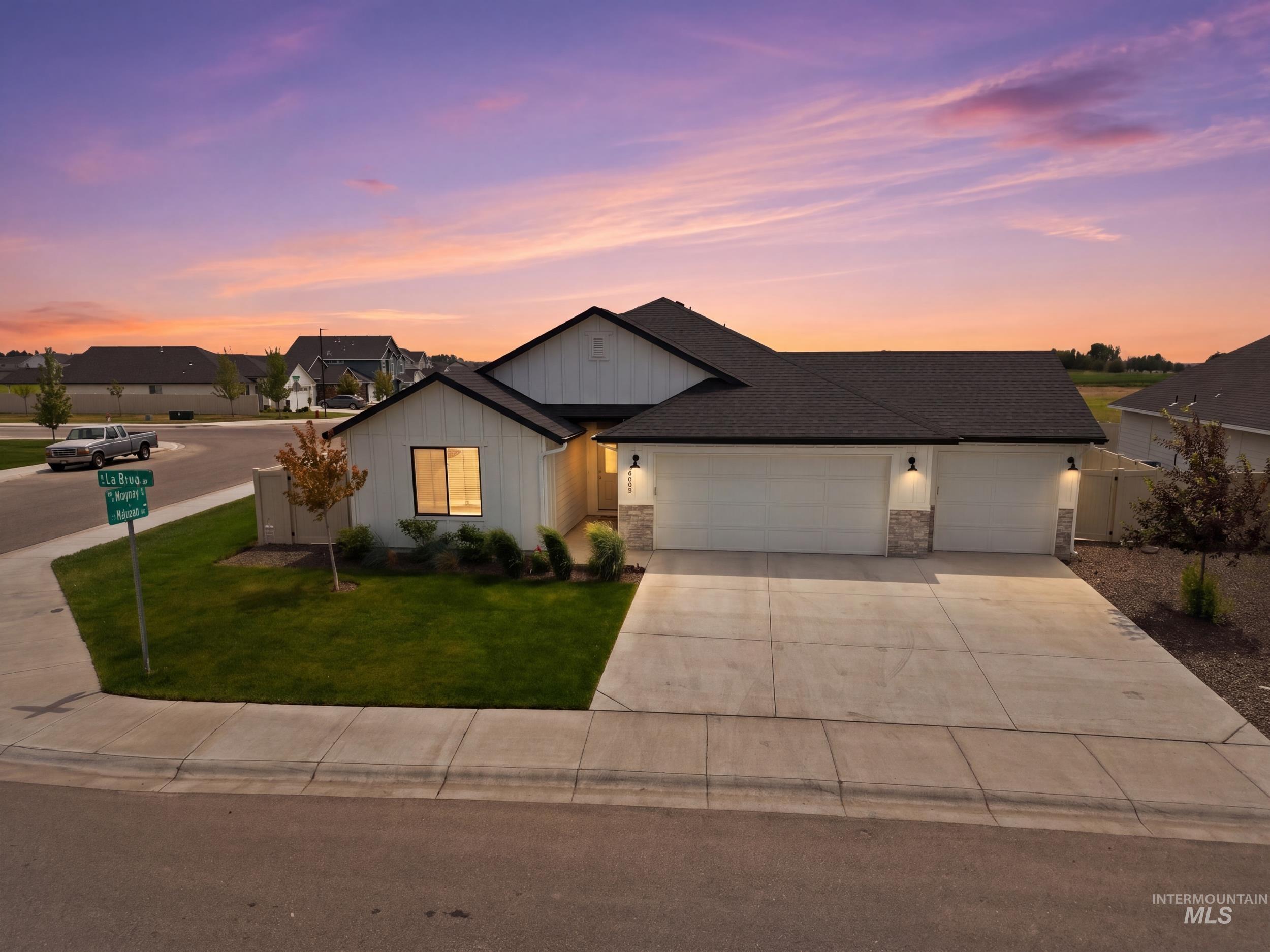 3665 W Lane Meridian, ID 83642 - Photo 1 of 42 Contemporary white exterior with dark trim and a dark shingle roof