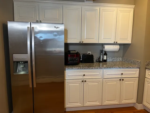 a kitchen with appliances cabinets and a counter space