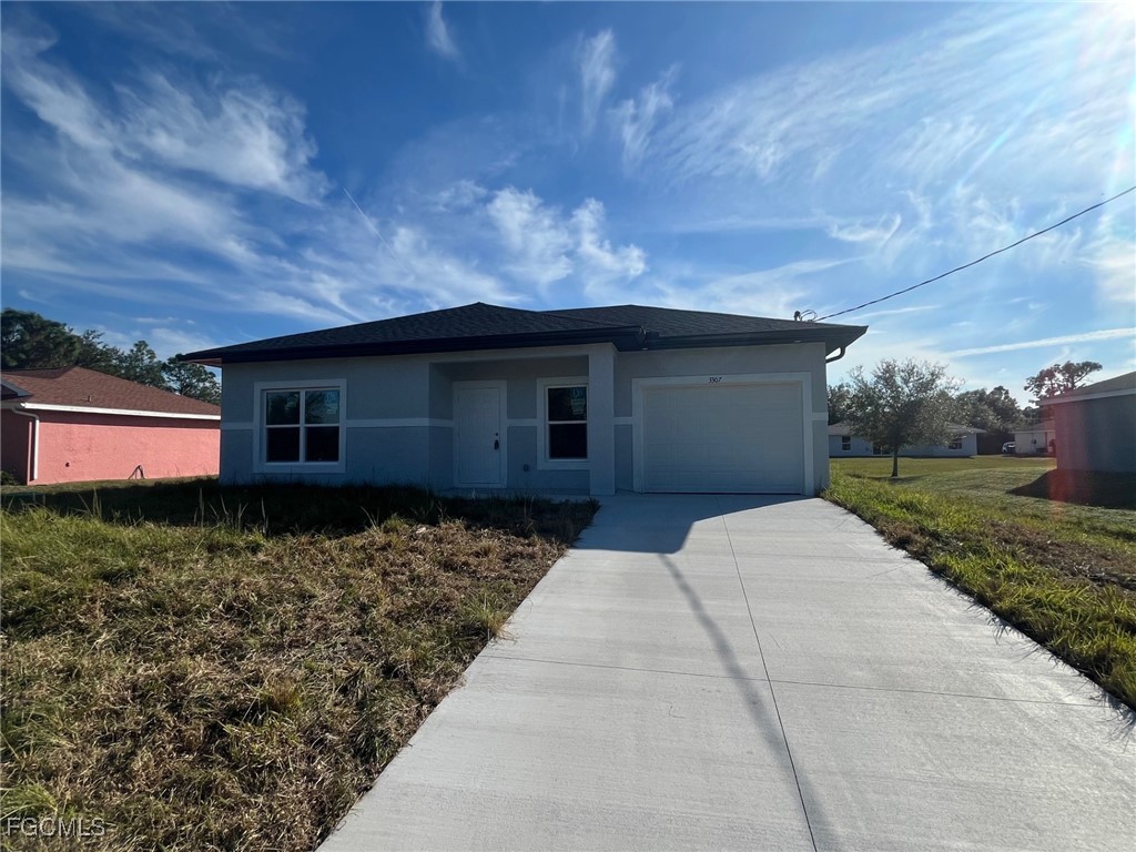 3307 50th Street West Lehigh Acres, FL 33971 - Photo 1 of 15 a house view with a backyard space