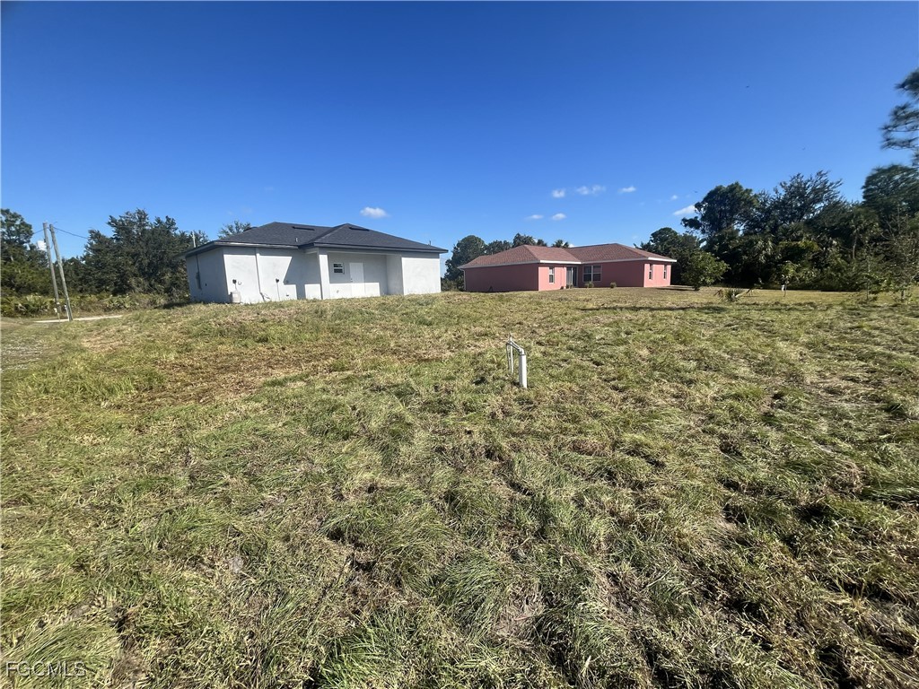 3307 50th Street West Lehigh Acres, FL 33971 - Photo 14 of 15 a view of a house with a yard