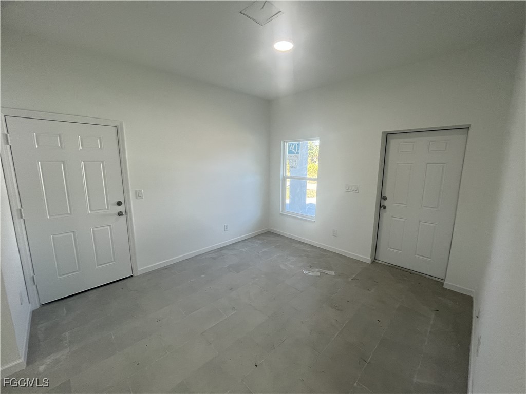 3307 50th Street West Lehigh Acres, FL 33971 - Photo 5 of 15 an empty room with windows