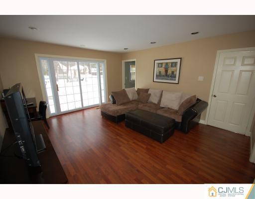 4 Edgewood Road Old Bridge, NJ 07747 - Photo 2 of 7 a living room with furniture window and wooden floor