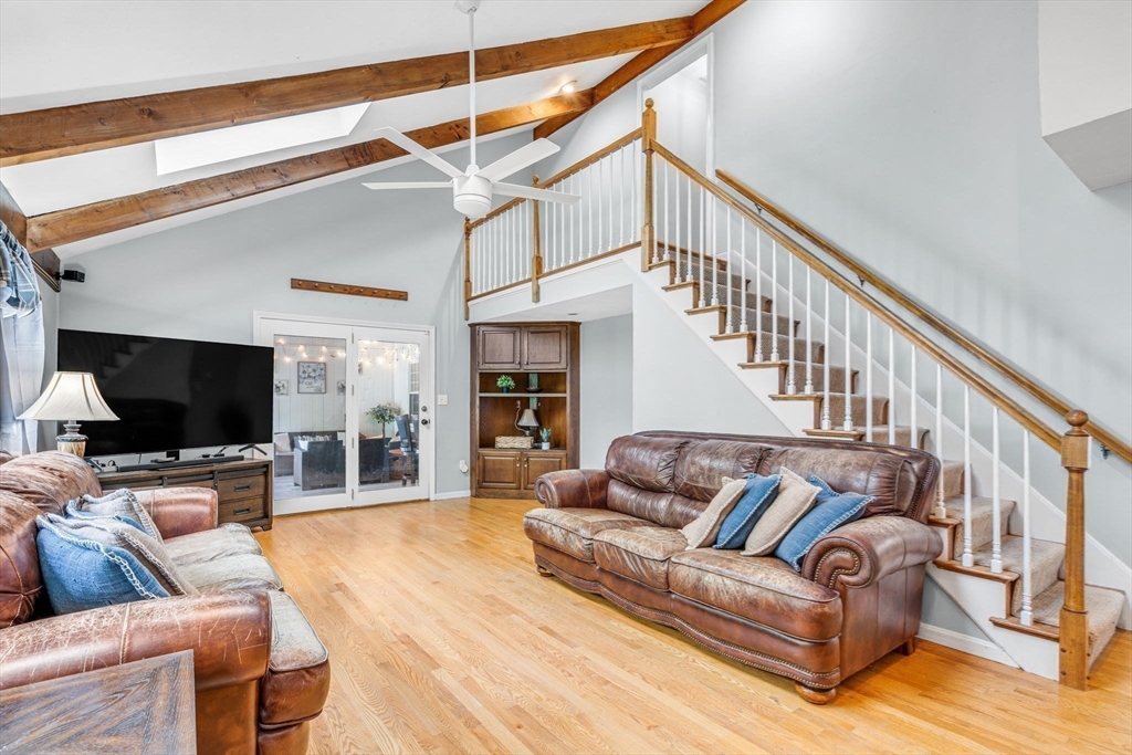 3 Erin Lane Norfolk, MA 02056 - Photo 14 of 37 a living room with furniture and a flat screen tv