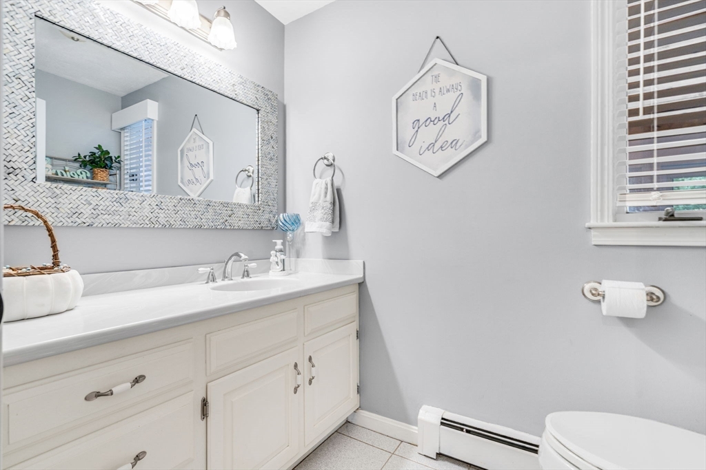 3 Erin Lane Norfolk, MA 02056 - Photo 17 of 37 a bathroom with a toilet sink and mirror