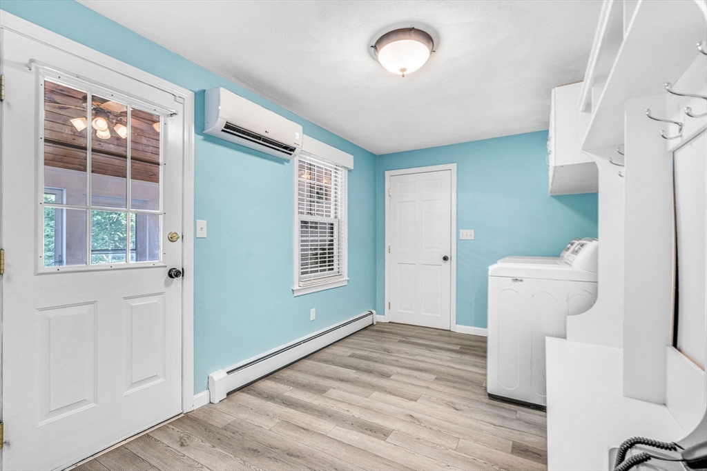 3 Erin Lane Norfolk, MA 02056 - Photo 18 of 37 a view of a livingroom with wooden floor and a window